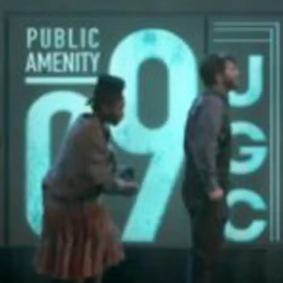 Urinetown image, and woman follows behind a man as they walk in front of a poster reading Public Amenity UGC.