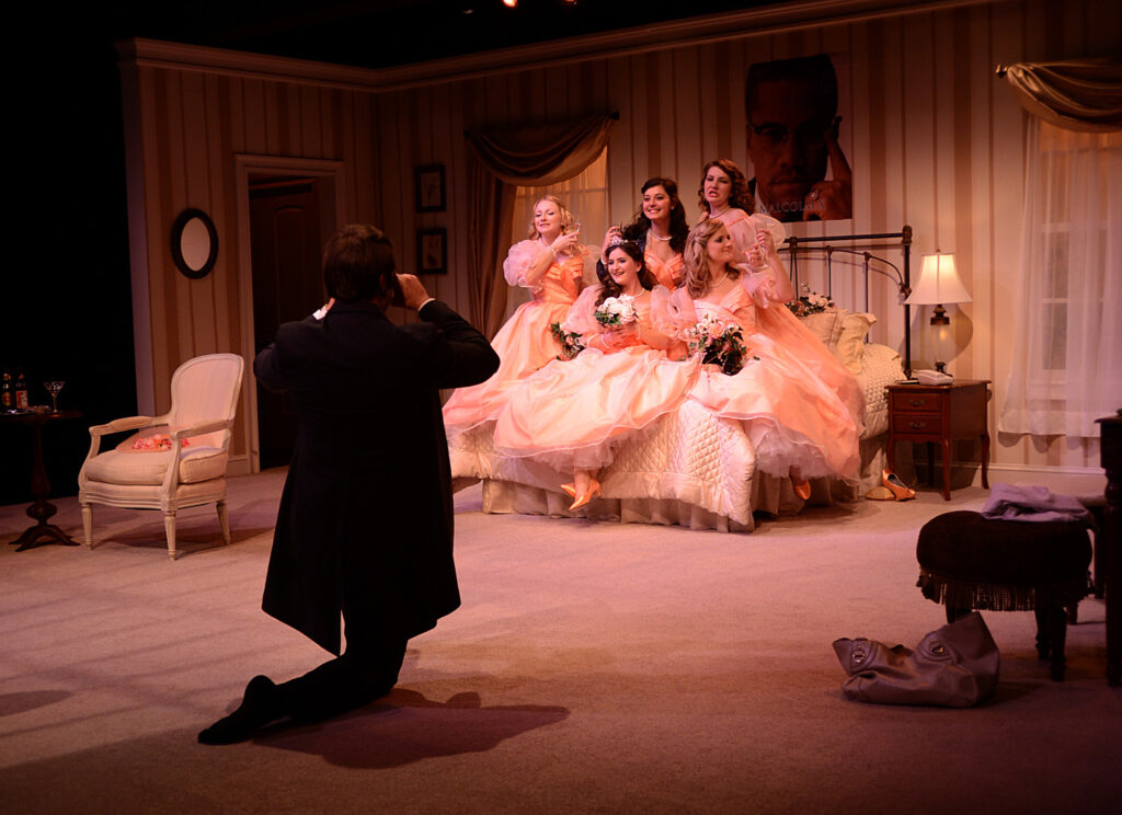 A stage scene from Five Women Wearing the Same Dress